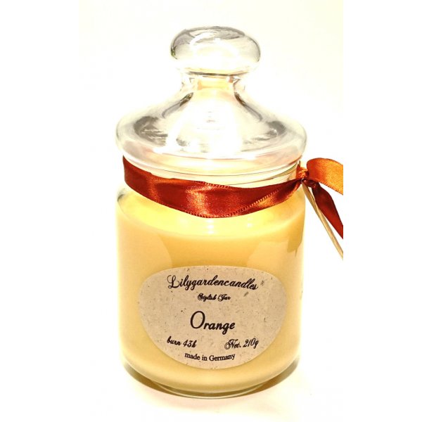 Scented candle orange in a glass 210g