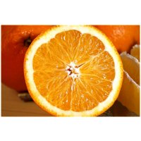 Scented candle orange in a glass 210g